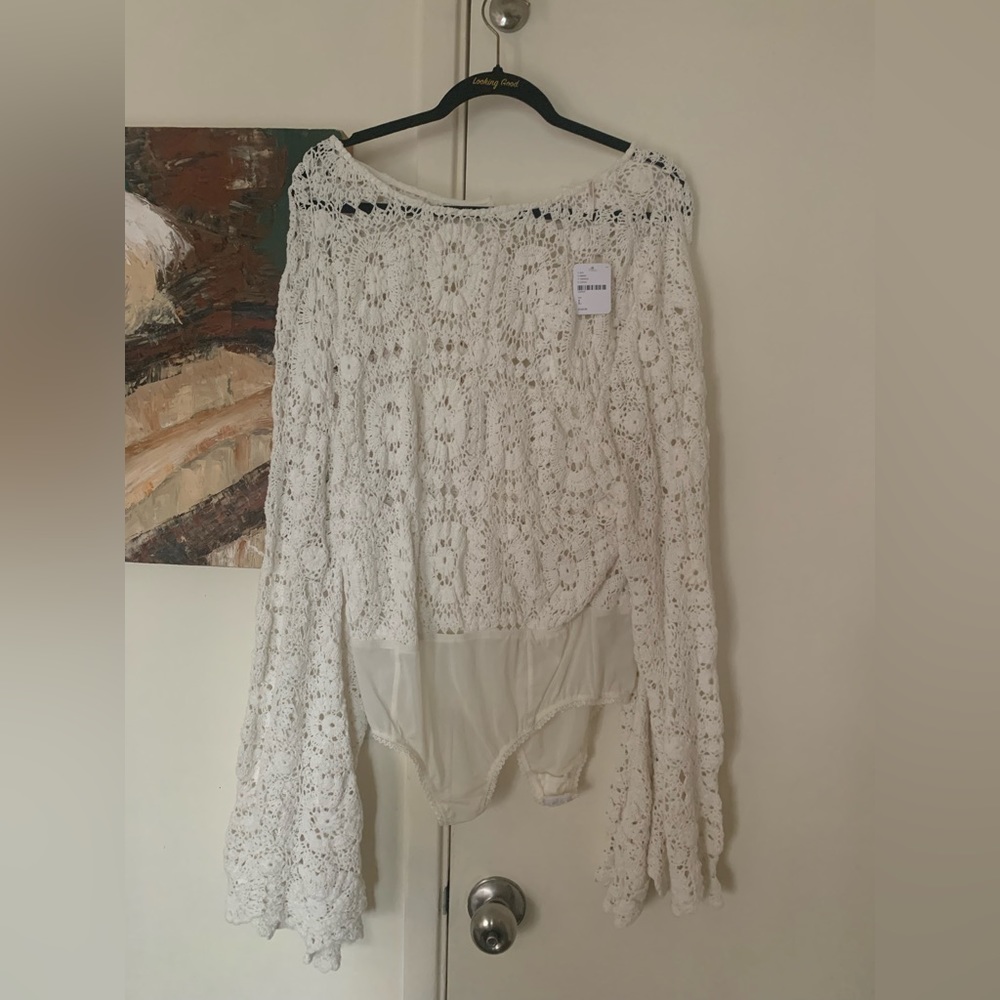 Free People White bodysuit never been worn